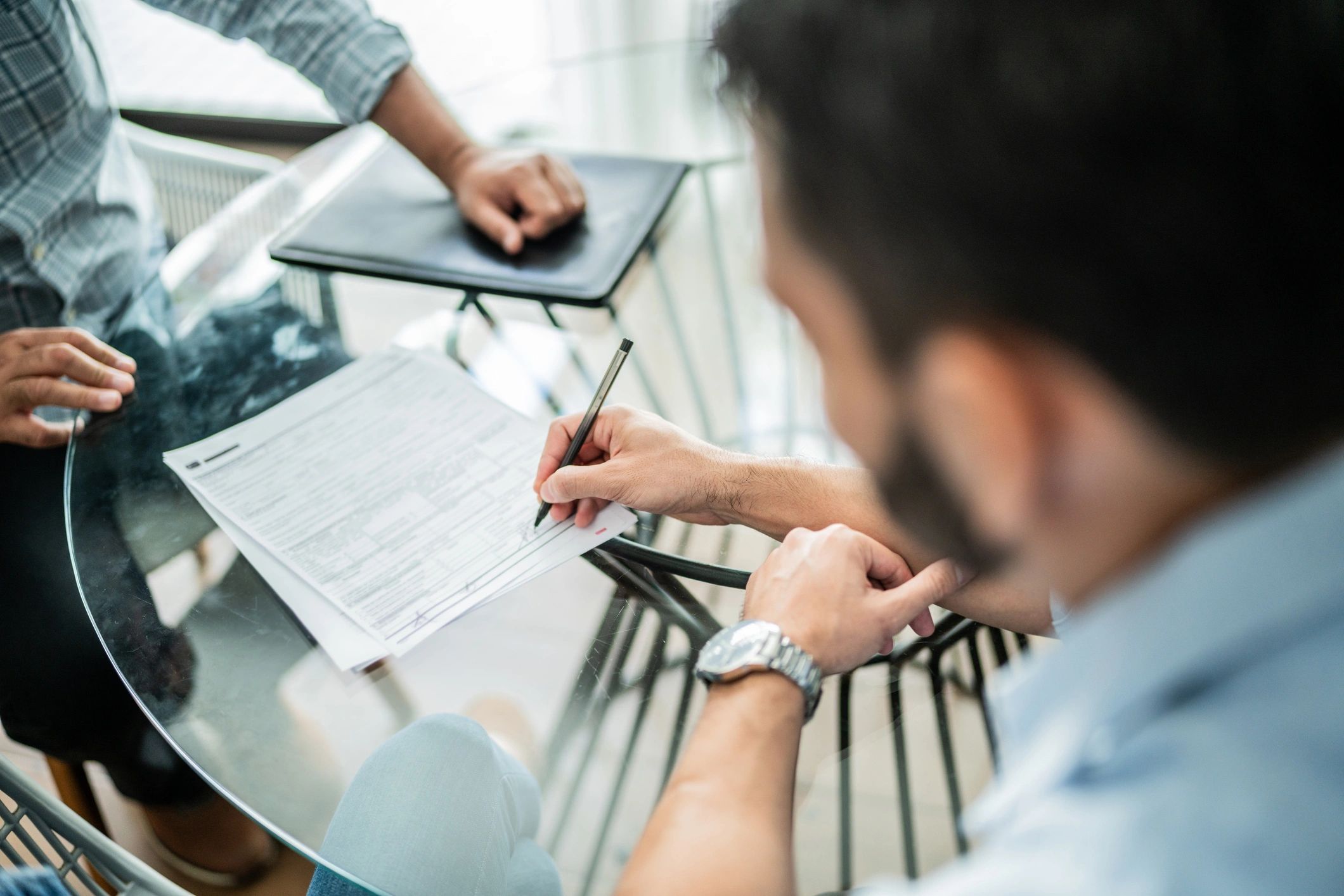 Professional reviewing and signing a business agreement